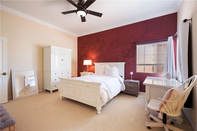 bedroom featuring an accent wall, baseboards, ornamental molding, light carpet, and multiple windows