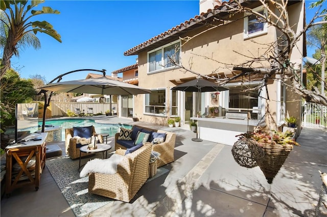 back of property featuring stucco siding, a patio, outdoor lounge area, a fenced in pool, and fence private yard