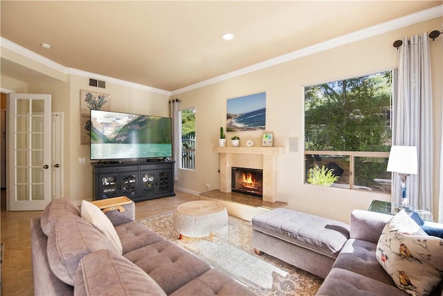 living area featuring a high end fireplace, visible vents, and ornamental molding