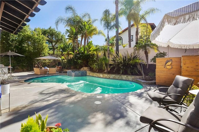 view of pool featuring an outdoor living space, a pool with connected hot tub, a patio area, and a fenced backyard