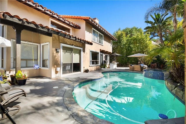 pool with a patio