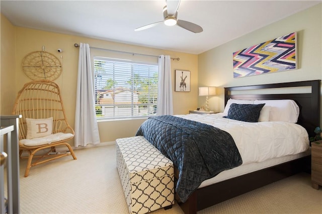 bedroom with a ceiling fan and carpet floors