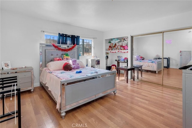 bedroom with light wood finished floors