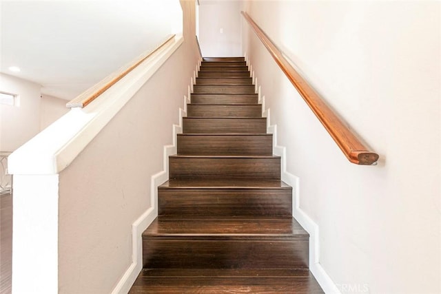 stairs with recessed lighting and wood finished floors