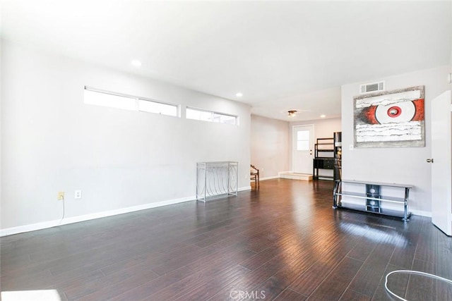 living room with visible vents, recessed lighting, baseboards, and wood finished floors