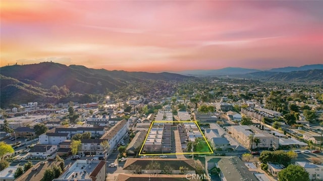 birds eye view of property featuring a mountain view