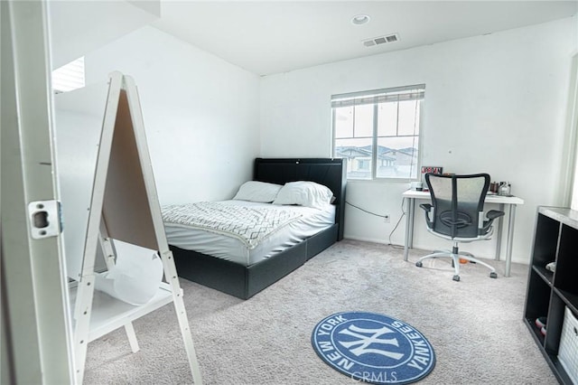 carpeted bedroom with visible vents