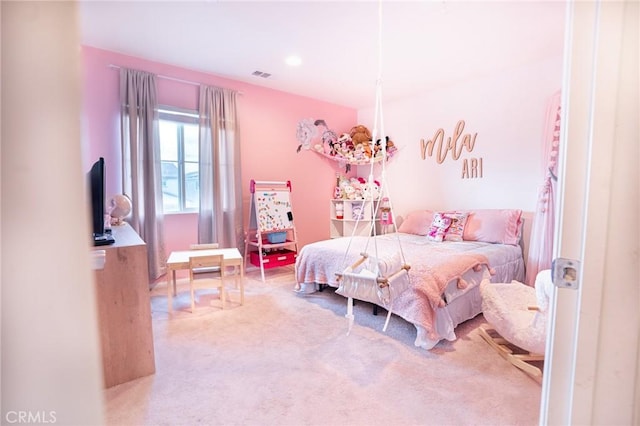 bedroom with visible vents and carpet flooring