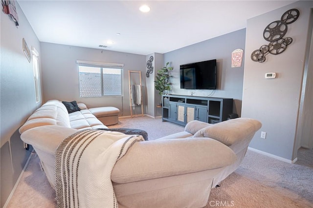 living area with recessed lighting, visible vents, baseboards, and carpet