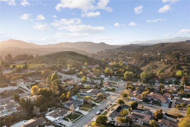 birds eye view of property featuring a mountain view and a residential view