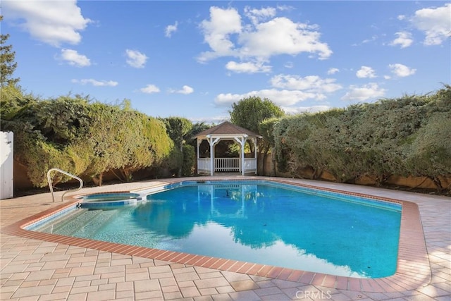 view of swimming pool with a gazebo, a patio, and a pool with connected hot tub