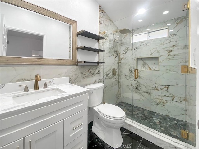 full bathroom featuring vanity, a marble finish shower, tile walls, toilet, and marble finish floor