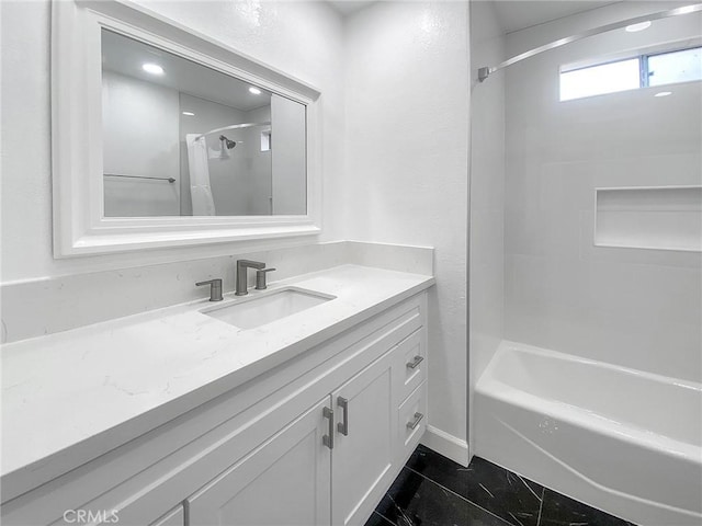 bathroom with vanity and bathtub / shower combination