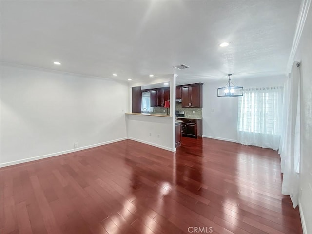 unfurnished living room with visible vents, baseboards, recessed lighting, dark wood-style flooring, and ornamental molding