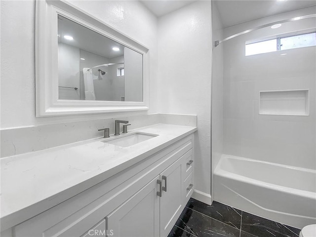 bathroom featuring bathing tub / shower combination and vanity