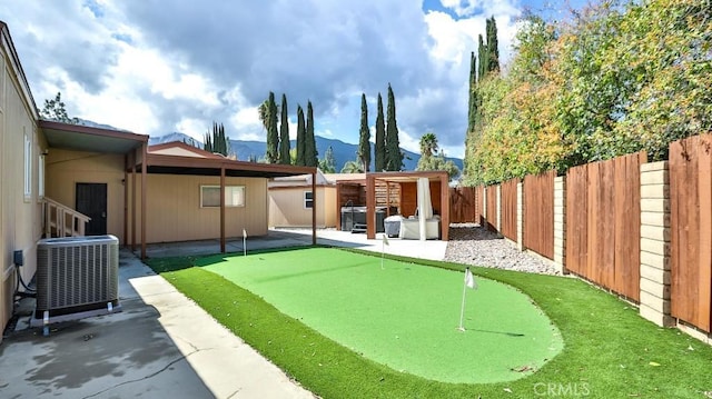 view of yard featuring cooling unit, a patio, and a fenced backyard