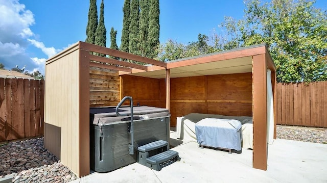 view of outdoor structure featuring fence