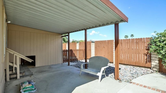 view of patio featuring fence