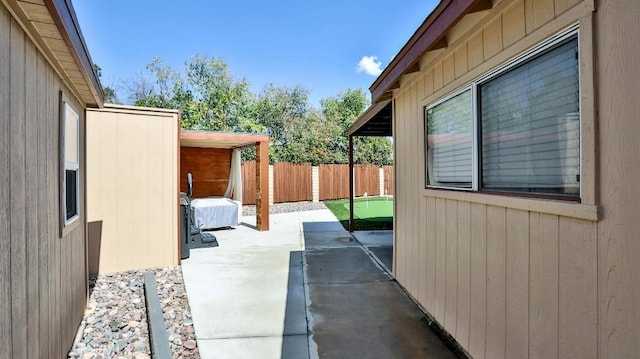 view of patio featuring fence