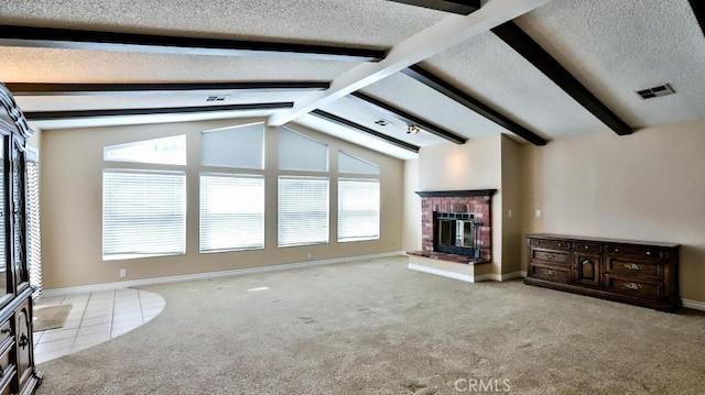 unfurnished living room featuring visible vents, a textured ceiling, a fireplace, carpet flooring, and vaulted ceiling with beams