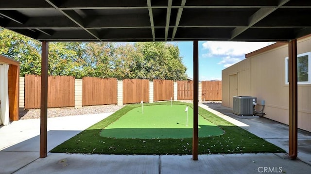 view of patio with cooling unit and a fenced backyard