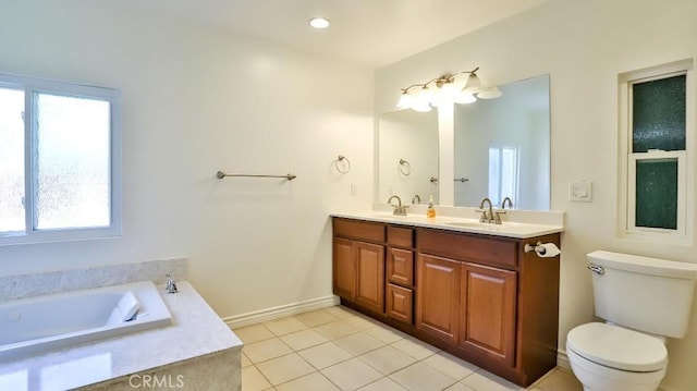 bathroom with tile patterned floors, a garden tub, toilet, a sink, and double vanity