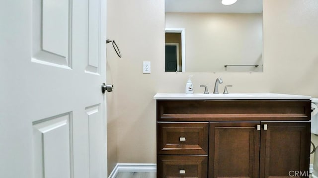 bathroom featuring vanity and baseboards