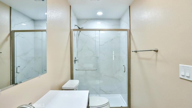 bathroom with a marble finish shower, toilet, and visible vents