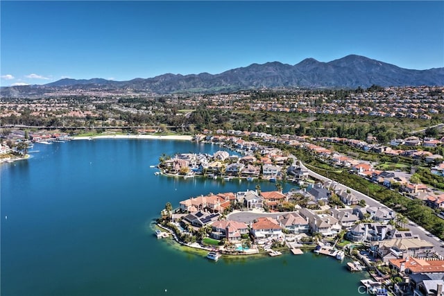 birds eye view of property featuring a residential view and a water and mountain view