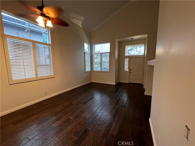 entrance foyer with baseboards, lofted ceiling, dark wood-style flooring, and a ceiling fan