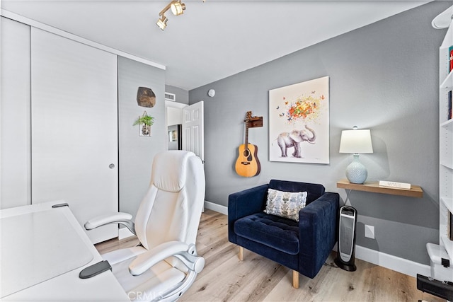 office featuring light wood finished floors and baseboards