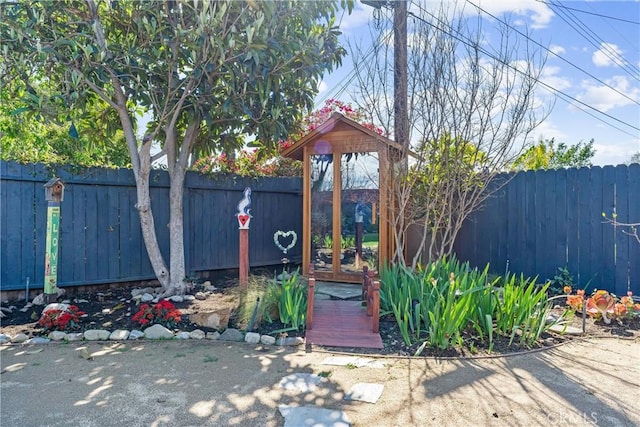 exterior space with a fenced backyard