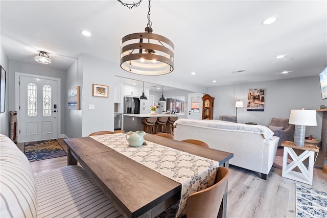 dining area with recessed lighting, visible vents, and light wood-type flooring