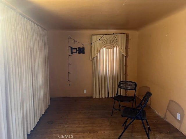 sitting room featuring wood finished floors