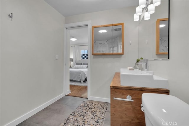 ensuite bathroom with vanity, visible vents, baseboards, ensuite bathroom, and a chandelier