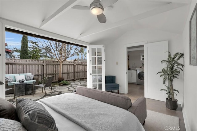 tiled bedroom with lofted ceiling, access to outside, separate washer and dryer, and ceiling fan