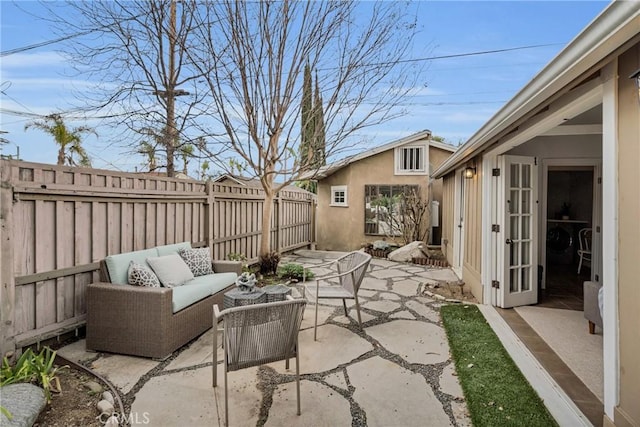 view of patio with a fenced backyard and an outdoor hangout area