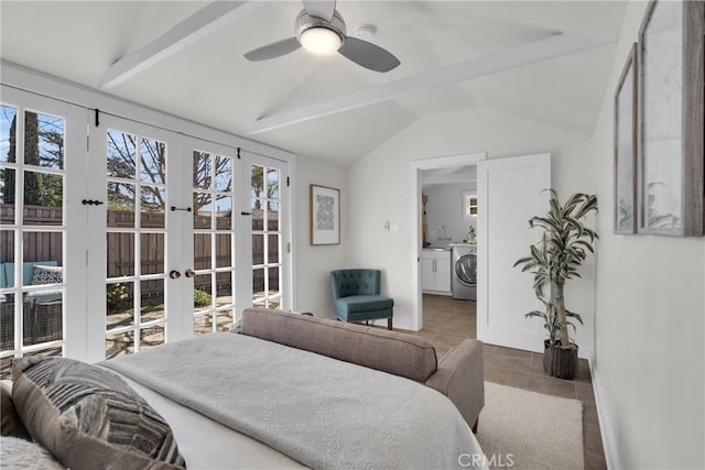 tiled bedroom with a ceiling fan, baseboards, lofted ceiling, washer / clothes dryer, and french doors