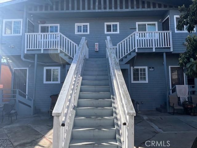 rear view of house with stairway