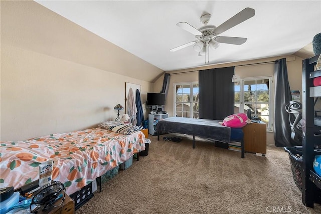 bedroom with lofted ceiling, carpet flooring, and ceiling fan