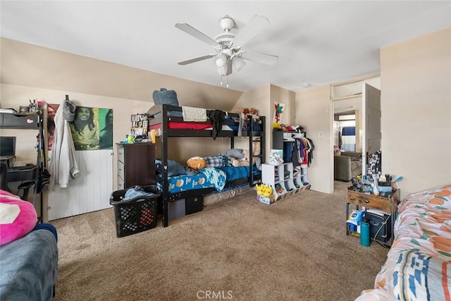 carpeted bedroom featuring a ceiling fan