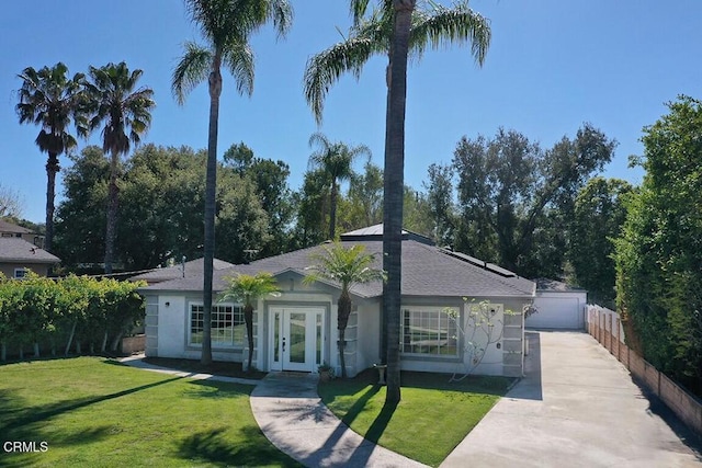 single story home featuring a front lawn, french doors, fence, and stucco siding