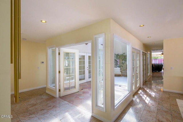 doorway to outside featuring recessed lighting, french doors, and baseboards