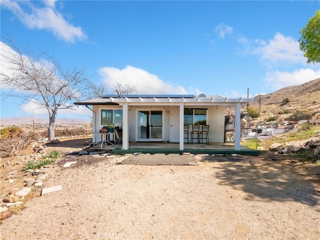 rear view of house with a patio