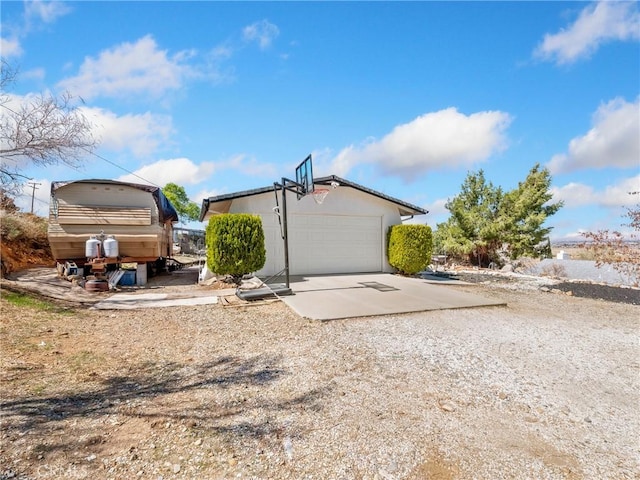 exterior space featuring a garage and concrete driveway