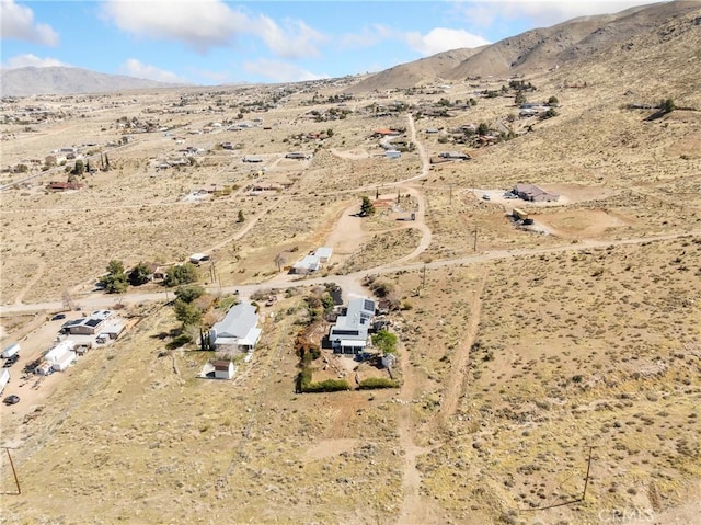 bird's eye view featuring a mountain view and a desert view