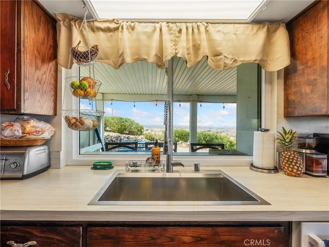 kitchen with a sink and light countertops