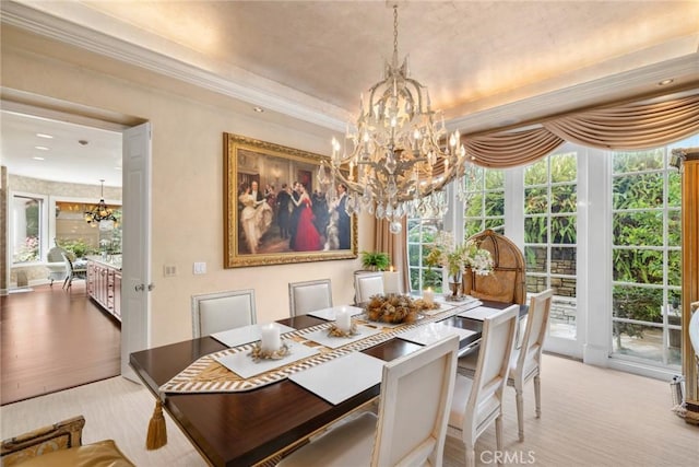 dining area featuring plenty of natural light, a chandelier, and ornamental molding