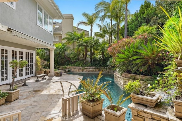 pool featuring a patio area and french doors