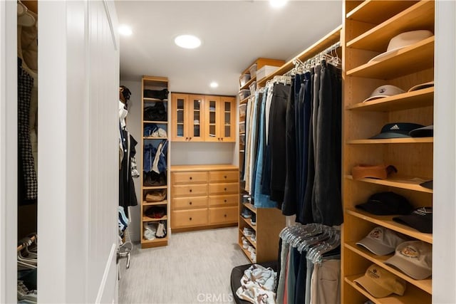 spacious closet featuring light wood-style flooring